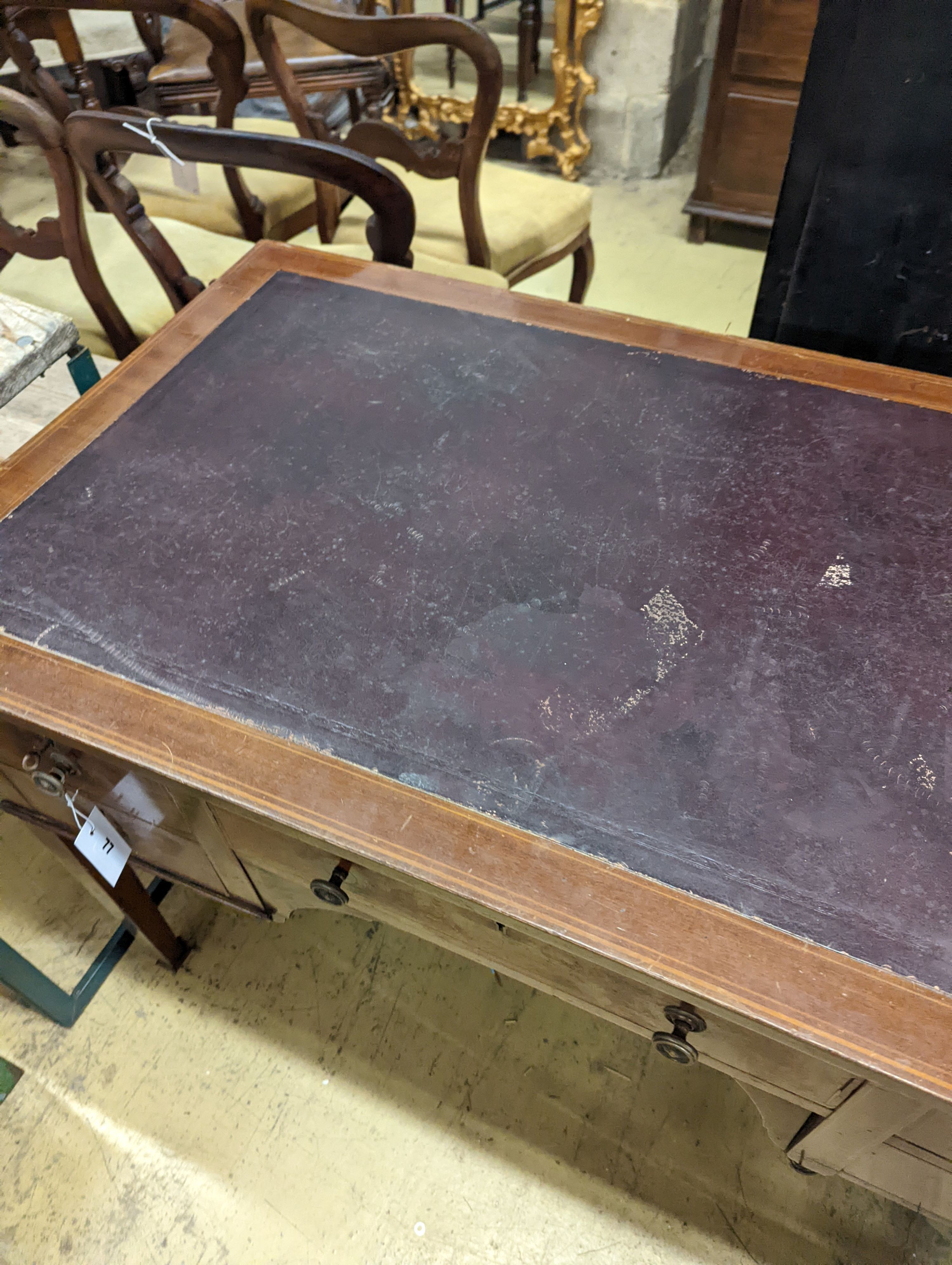 An Edwardian inlaid mahogany kneehole writing table, width 107cm, depth 60cm, height 75cm